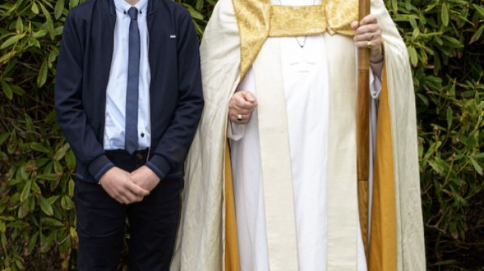 Trevor Dukelow at his Confirmation ceremony with Bishop Paul Colton.