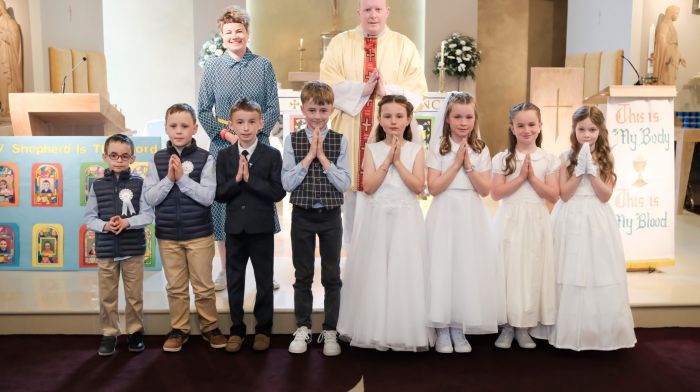 Pupils of Rath National School received their First Holy Communion last Sunday.  Suzy McCarthy (class teacher) and Fr Evin O’ Brien with (from left): Jerry O’Mahony, Cillian O’Mahony, Eóin O’Donovan, Christopher O’Neill, Éirinn O’Driscoll, Kitty Collins, Méabh Collins and Orlaith Brennan.  (Photo: Philip Cullinane)