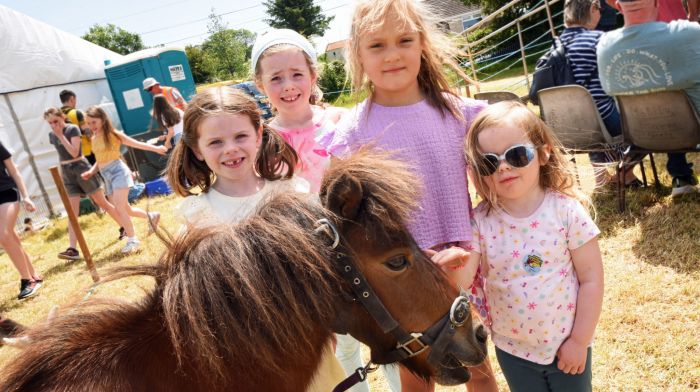 Ciara, Aoife and Fia Bennett from Ballinhassig with Emma Harrington from Ballyfeard next to Harvey the miniature horse at the Belgooly Show. (Photo: Siobhán Russell)