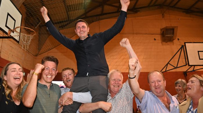 Independent Ireland’s Daniel Sexton is hoisted up after his election. Left: Social Democrat Holly Ciarns makes a point to former garda Noel O'Donovan in Clonakilty count centre. (Photos: Martin Walsh & Andy Gibson)