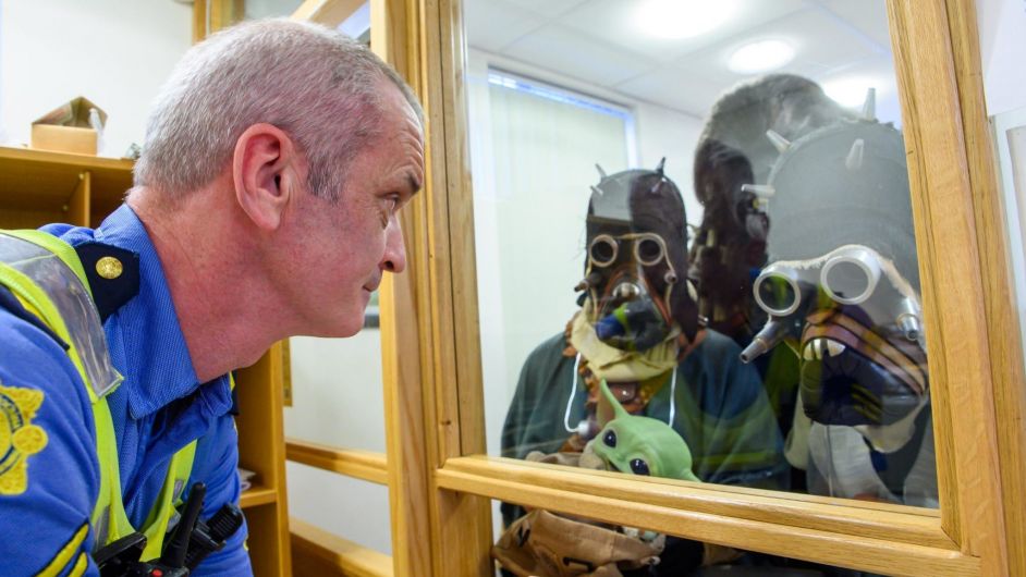 Garda Sgt. Chris Brosnan dealing with passport queries at the Dunmanway Feel the Force Star Wars festival over the June Bank Holiday Weekend.
Picture. John Allen