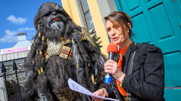 Deputy county mayor Cllr Deirdre Kelly opening the event with Wookie bounty hunter Krrsantan from the Reel Icons cosplay group at the Dunmanway Feel the Force Star Wars festival which was held over the June bank holiday weekend.  (Photo: John Allen)