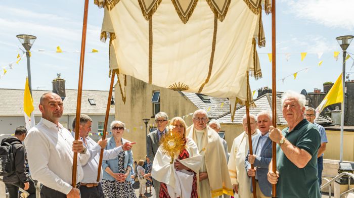 The annual Corpus Christi procession was a historic one in Castletownbere as it was the first time that women, Maureen Power and Ellen Dunne, carried the Monstrance through the town. The procession was officiated by Fr Noel Spring and Fr John Kerin. All the First Holy Communicants from the parish took part in the parade. Back: Johnny Orpen, Maureen Power, John Wiseman, Barry O’Sullivan, Fr John Kerin,  Fr Noel Spring and Liam O’Driscoll.  Front: Krzysztof Chrzanowski, Ellen Dunne and Francis Lehane.   (Photo: Anne Marie Cronin)