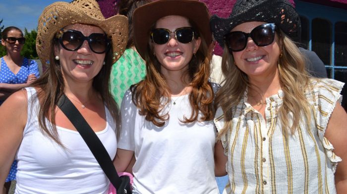 Aine Long from Cork with Ballydehob ladies Eimear and Ciara O'Regan soaking in the sunshine at the Ballydehob Country Music Festival which was held last weekend. (Photo: Anne Minihane)