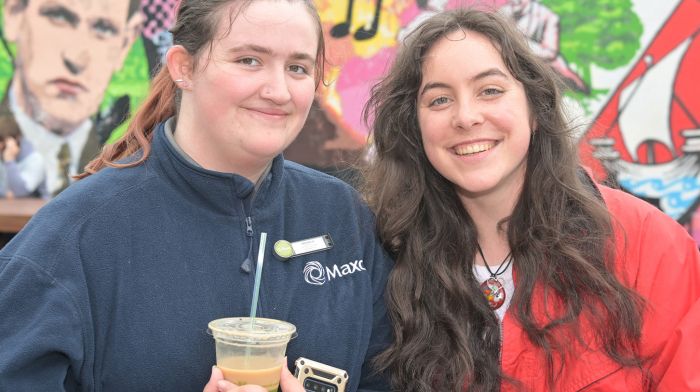 Emma O’Donovan from Ardfield catching up with her friend Siofradh Walsh-Deelo at the parklet in Kent Street, Clonakilty.   (Photo: Martin Walsh)