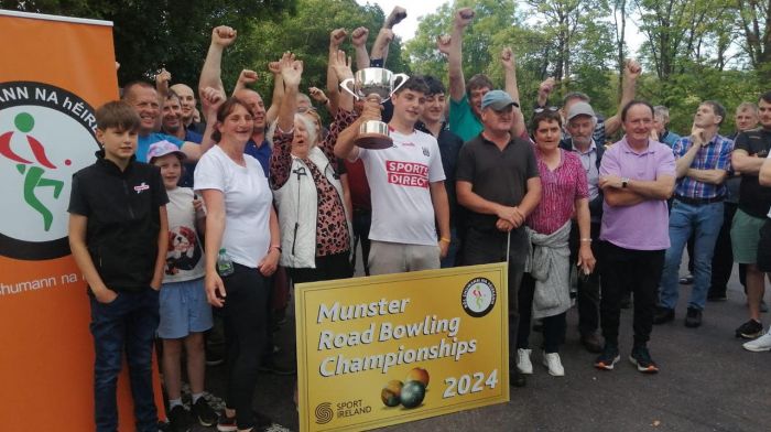 Shane Crowley from Dereenatra, Schull, brandishing the trophy surrounded by his supporters at the end of a great day of bowling, in which Shane exhibited great skill which won him the U18 road bowling county final title.