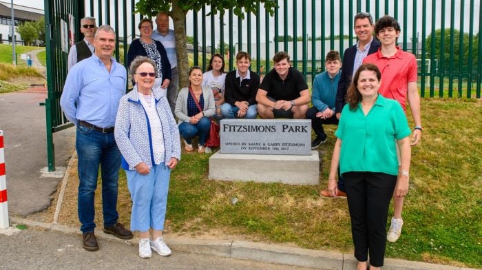 Fergal McCarthy (principal) with Anne Fitzsimons (wife of Garry) and Deirdre Fitzsimons (wife of Shane) and family members at the unveiling of a stone to mark the official opening of Fitzsimons Park at Kinsale Community School.  (Photo: John Allen)