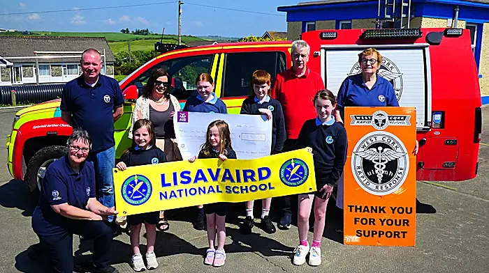 Lisavaird National Schools parents association recently presented a cheque of €1,550 from the Rosemary Calnan tractor, truck and vintage car run to West Cork Rapid Response members with the help of some of the pupils of Lisavaird NS.  Back (from left) Liam Slattery WCRR, Marian O’Keeffe, Anna Calnan, Matthew Calnan, Paul Calnan and Betty Hennessy WCRR. Front (from left) Kate Crowley WCRR, Isla O’Keeffe, Ella Mae White Slattery and Kimberley Rose White Slattery.