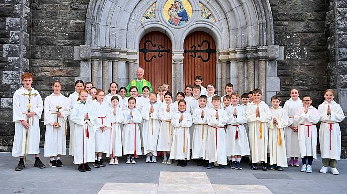 Fr John Kingston at the Church of the Nativity of the Blessed Virgin Mary, Timoleague with altar servers following a celebration mass where he was joined by parishioners and friends to mark the golden jubilee of his ordination to the priesthood. (Photo: Martin Walsh)