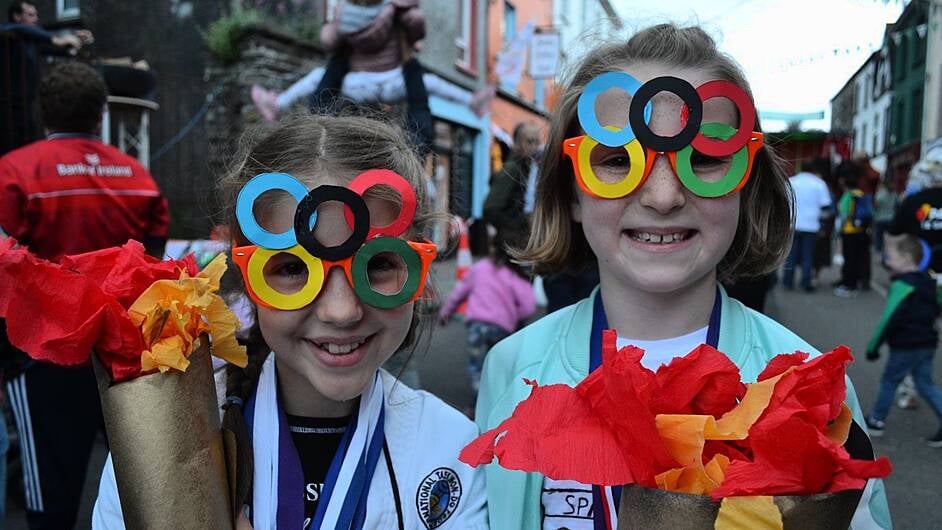 Vivienne McCarthy, Caheragh and Méabh Gough on fire with their Olympic flames at the Skibbereen Festival Street Party last Friday evening. Photo; Anne Minihane.