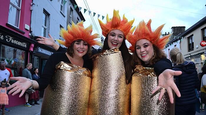 Bernadette O'Mahony, Marie Flanagan and Catherine Casey otherwise known as the O'Donovan sisters from Cork Road in Skibbereen dressed as the Olympic flames at the amazing Olympic Street Party at Skibbereen Arts Festival last Friday evening. Photo; Anne Minihane.