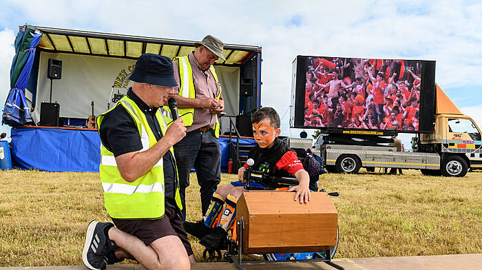 Sean O'Flynn, Paddy Ryan and Adam Clarke (Newcestown) who drew the winning ticket from the drum in the raffle, first prize was a CFMOTO 450 Quad Bike as Armagh fans celebrate winning the All Ireland Football title in the background on a big screen. The West Cork Vintage Ploughing & Threshing Association annual Charity Vintage Working Day was held in Killavarrig, Timoleague. Proceeds from the event will go to the New Autism Unit at Clogagh National school, Bantry Stroke Unit and The West Cork Jesters.
Picture: David Patterson, Tractor Run – Cork