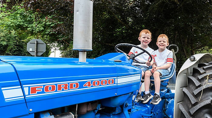 Four-year-old twins Freddy and Bobby Cullen from Enniskeane enjoying their day at the tots tractor, car and truck run.  (Photo: David Patterson)