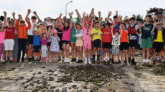 Participants showing their delight as the crabs make their way back to the sea following the children’s crab fishing competition during the Courtmacsherry Harbour Festival.  (Photo: Martin Walsh)