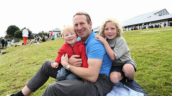 Con O'Sullivan with his sons Alfie (6) and Harry (3) watching the soccer at the Schull Regatta. (Photo: Carlos Benlayo)