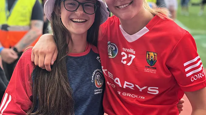 Karen O'Sullivan with her older sister Ciara, who won an All-Ireland camogie medal last Sunday in Croke Park after Cork defeated Galway.
