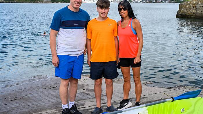 Joey Hurley with his parents Mark Hurley and Marion Gabriel on the slipway at Summercove in Kinsale at the start of Joey’s duathlon challenge.  (Photo:  John Allen)