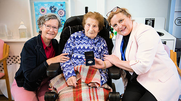 Anna Callanan (centre), proudly presenting her presidential medal as she celebrates her 103rd birthday, with Sheelagh Broderick, HSE Health Promotion (left), and Mary Nolan, director of nursing at Clonakilty Community Hospital. (Photo: Anna Groniecka)