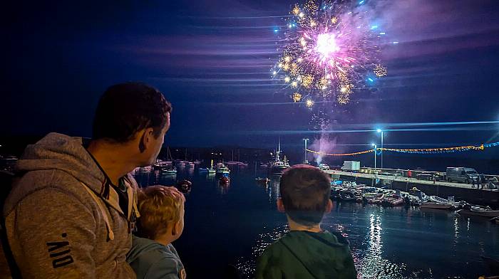 Christopher, Alex (3) and Cian (5) McSweeney enjoying the Saturday night fireworks at Schull Regatta. (Photo: Christina McSweeney)