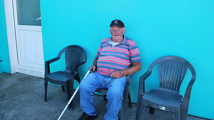 Dan McCarthy enjoying some sun outside his home on Heir Island. (Photo: Paul Levis)