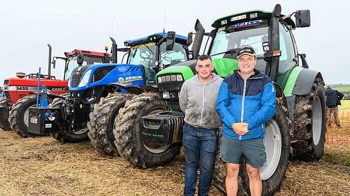 Ronan Coughlan from Ballineen, with driver Eamon Crowley from Ahiohill, took part in the tractor pulling in a Deutz-Fahr at the Ahiohill Vintage Club’s harvest working day in Lisnacunna, Enniskeane on the lands of Niall and Walter Helen.  (Photo: David Patterson)