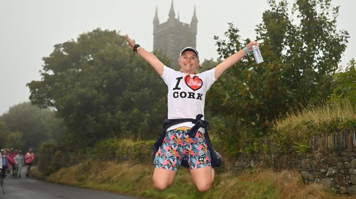 Janeane Watt, Carrigadrohid, Macroom jumping for joy against the backdrop of Lislee Church during the Great Wild Atlantic Marathon Walk in aid of the Courtmacsherry RNLI lifefboat. (Photo: Martin Walsh)