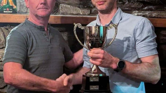 The overall winner, Conor Hurley, receiving the captain's prize trophy from Tony O’ Mahony (left), De Courcey Golf Society Captain.