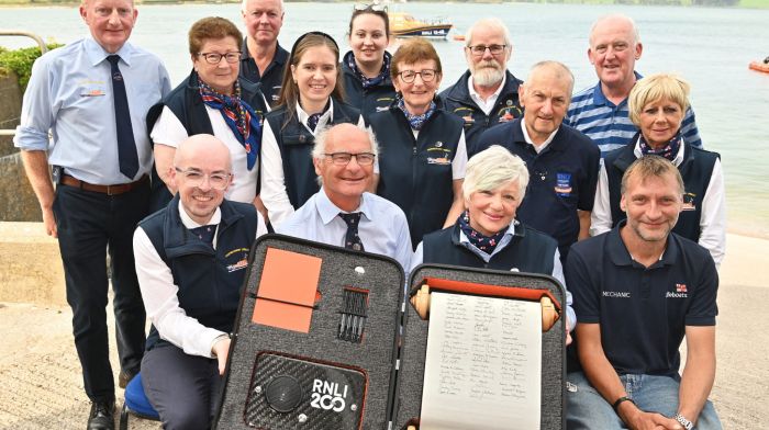 On Sunday a specially commissioned scroll was signed by members of the Courtmacsherry RNLI.  
Pictured front are signatories (left to right): Paul Finn (Fundraising), Brian O’Dwyer (Operations), Angela Veldman (Education) and Stuart Russell (Visits). Also included are standing (left to right): Vincent O’Donovan, Martha Drake, David Dunwoody, Fiona O’Regan, Rachel Kelly, Assumpta Drake, Hank Veldman, Diarmuid O’Mahony, Liam Murphy and Joan O’Donovan.  Photo: Martin Walsh.