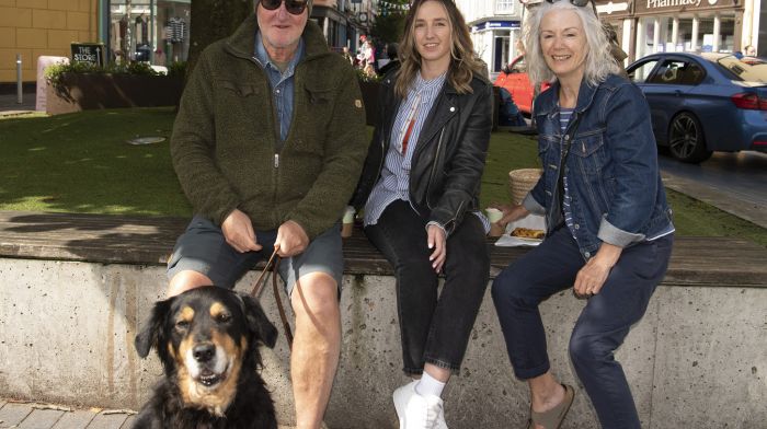 Hannah McGovern, Clonakilty (centre), with Paul and Susan McGovern from Kinsale and their dog Bess, having a chat and some coffee in Astna Square.  (Photo: Martin Walsh)