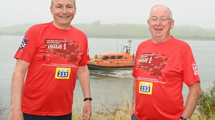 An Tánaiste, Minister for Foreign Affairs and Minister for Defence Micheál Martin (left) with Ray Doherty, Courtmacsherry, at the beginning of the Great Wild Atlantic Marathon Walk which was held recently.  The event is a major fundraiser for the Courtmacsherry RNLI station, one of the oldest lifeboat stations in Ireland.  The RNLB Val Adnams, the Shannon-class lifeboat, is in the background.  (Photo: Martin Walsh)