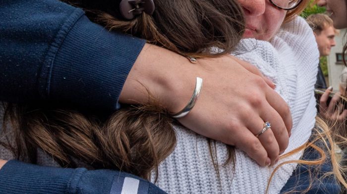 Ella Murphy from Macroom embracing her friend after receiving their Leaving Cert results last Friday.   (Photo: Andy Gibson)