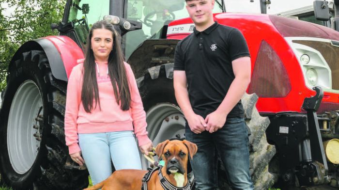 Jenna Mackey from Aherla and Nathan Rawley from Mayfield with Ollie the dog enjoying
their day at the Ballygurteen tractor, truck, car and bike run which started in Rossmore
and which was held in aid of the 2D Haematology Ward CUH and the Bone Marrow for
Leukaemia Trust. (Photo: David Patterson)