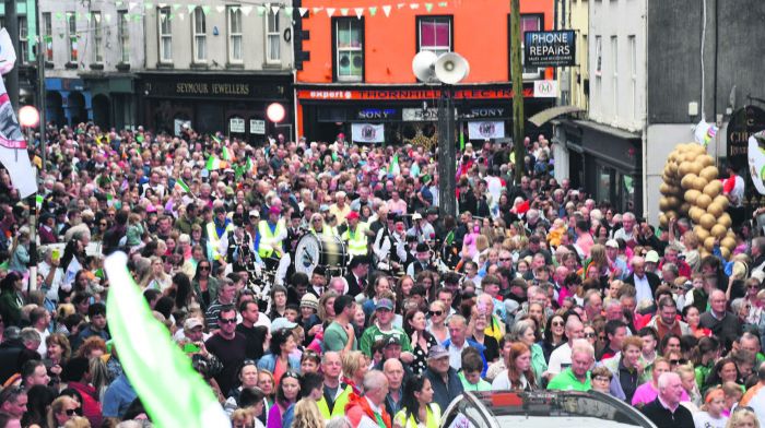 Members of Ballingeary Pipe Band, which formed part of the parade, along with Skibbereen’s own St Fachtna’s
Silver Band, are swallowed up in the masses. (Photo: Anne Minihane)