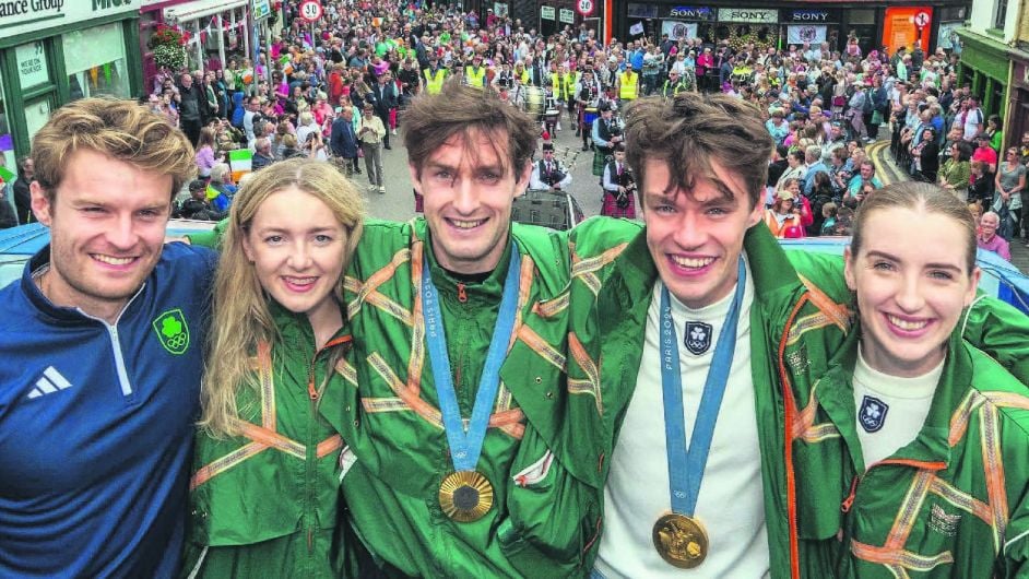 Jake McCarthy, Aoife Casey, Paul O'Donovan, Fintan McCarthy and Emily Hegarty on the open-top bus parading through Skibbereen. (Photo: Andy Gibson)