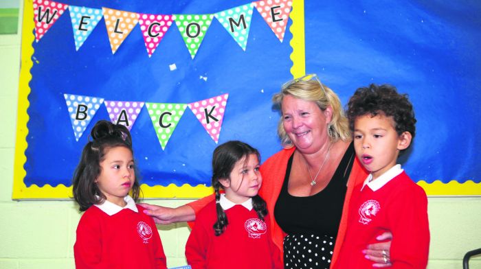 Hephzibah Hunt, Evie Johnson and Jonathan Hunt with principal Clara McGowan on their first day at St James National School in Durrus. (Photo: Carlos Benlayo)