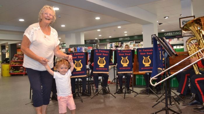 Young Frankie Keane with his nana Mairead Keane enjoying the wonderful music from  St. Fachtna's Silver Band when they played in for Skibbereen's Culture Night in Field's on Main Street. (Photo: Anne Minihane)