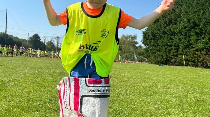 Junior infant Adam Harrington from Dromclough National School warming up for the sack race at the annual sports day at St Colum’s GAA pitch.