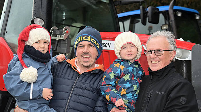 Sports journalist Denis Hurley from Upton with his sons Johnny (left) and Aaron and his father Jim, who lives in Kilbrittain pictured at the at the Kilbrittain Autism Tractor Run.  Photo: Martin Walsh.