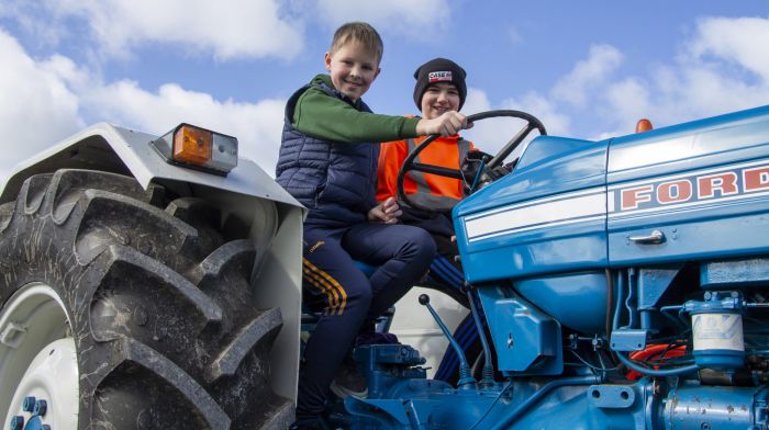 Odhran French and Connor Murphy up on the driving seat
of Kevin O’Briens Ford 4000 tractor taking part in a
tractor run in Raheen on Sunday. (Photo: Andrew Harris)