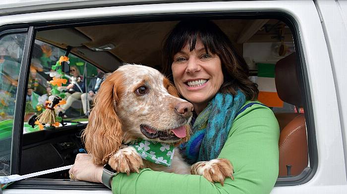 Claire O'Neill and Seamus taking part in the St Patrick's Day Parade in Skibbereen. Right: Emily Carroll and Amelia Murphy from Kinsale at their local parade.  Photos: Anne Minihane & John Allen)