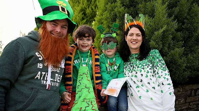 Dan and Marie Mc Carthy with children Daniel and Michael enjoying the St Patrick's day parade in Ballydehob. (Photo: Carlos Benlayo)