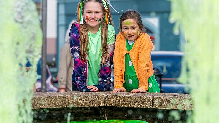 Ava Enright and Hannah O'Sullivan from Glengarriff enjoying the festivities at the Bantry St Patrick’s Day parade.   (Photo: Andy Gibson)