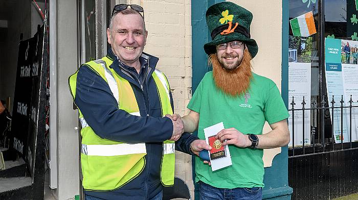 Tim Buckley presenting the prize for best decorated car to Nathan Kingston at the St Patricks Day parade in Dunmanway.  (Photo: David Patterson)