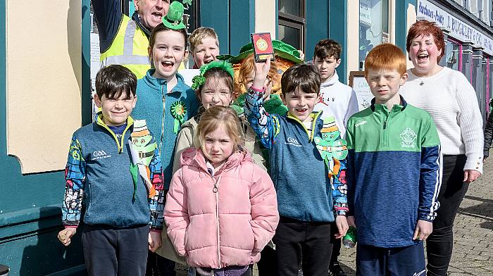 Tim Buckley, chairman of Dunmanway Chamber of Commerce,  presented Togher National School with the prize for best group/float at the Dunmanway St Patricks Day parade.  Representing the school were Ethan Hurley, Robin Baxendale, Alicia Hurley, Clodagh Cronin, Darragh Hurley, Ciaran O’Farrell, Orlaith O’Farrell, Liam Baxendale, Ari Hyland and school principal Majella Daly.   (Photo: David Patterson)