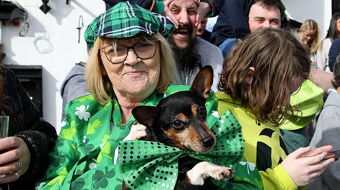 Phyl Carpenter and her dog Nancy enjoying the St Patrick's Day parade in Schull. (Photo: Carlos Benlayo)