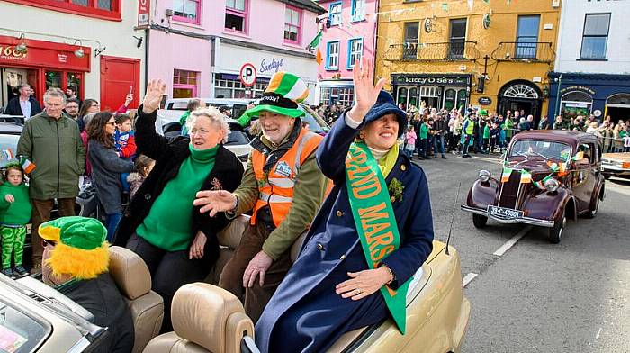 Grand marshal Carmel Murphy of The Well leading the Kinsale parade with Kate French of Kinsale Youth Community Centre and Jim Lyons of Kinsale Men’s Shed.  (Photo: John Allen)