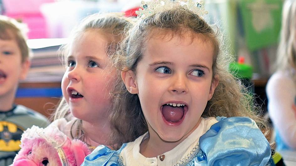 Eva Murphy (left) and Aisling McCarthy react to a storyteller during World Book Day at Barryroe National School. (Photo: Martin Walsh)