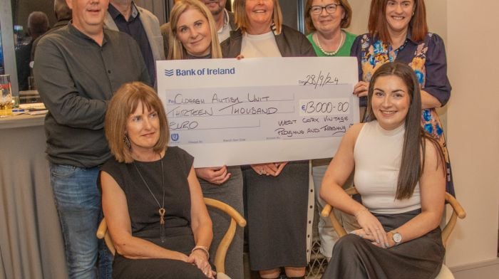 Accepting a cheque for €13,000 from the West Cork Vintage Ploughing and Threshing Association on behalf of the Clogagh Autism Unit were (back, from left): Paudie O’Leary, Seán Flynn, Helen O’Flynn (principal), Paddy Ryan, Lynda Farley, Colette O’Donovan and Kathleen Calnan. Seated (from left): Kathy Blair and Katie Desmond.  (Gearoid Holland)