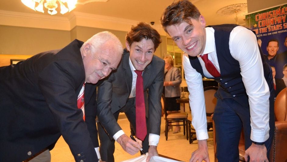 GOOD SIGNING Golden duo are pen-pals
Paul O'Donovan and Fintan McCarthy signing shirts, with club captain Sean O'Brien, at the Skibbereen Rowing Club Olympic Ball in the West Cork Hotel last Saturday evening. (Photo: Anne Minihane)