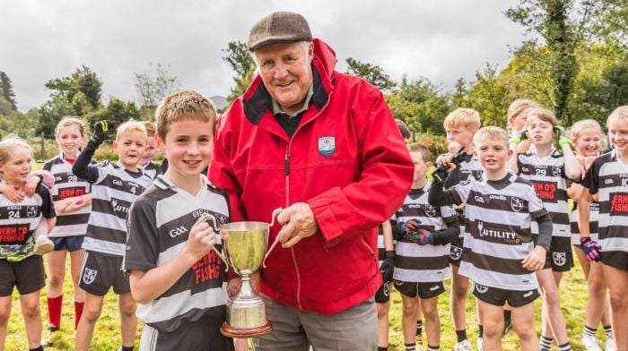 The Kevin Ger O’Sullivan cup was presented to Castletownbere’s U10 captain Luke Browne by Kevin Ger O’Sullivan . (Photo: Anne Marie Cronin)